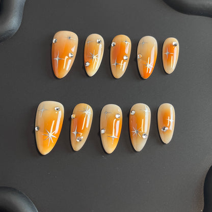 Orange Aura Star Almond Ombre Nails